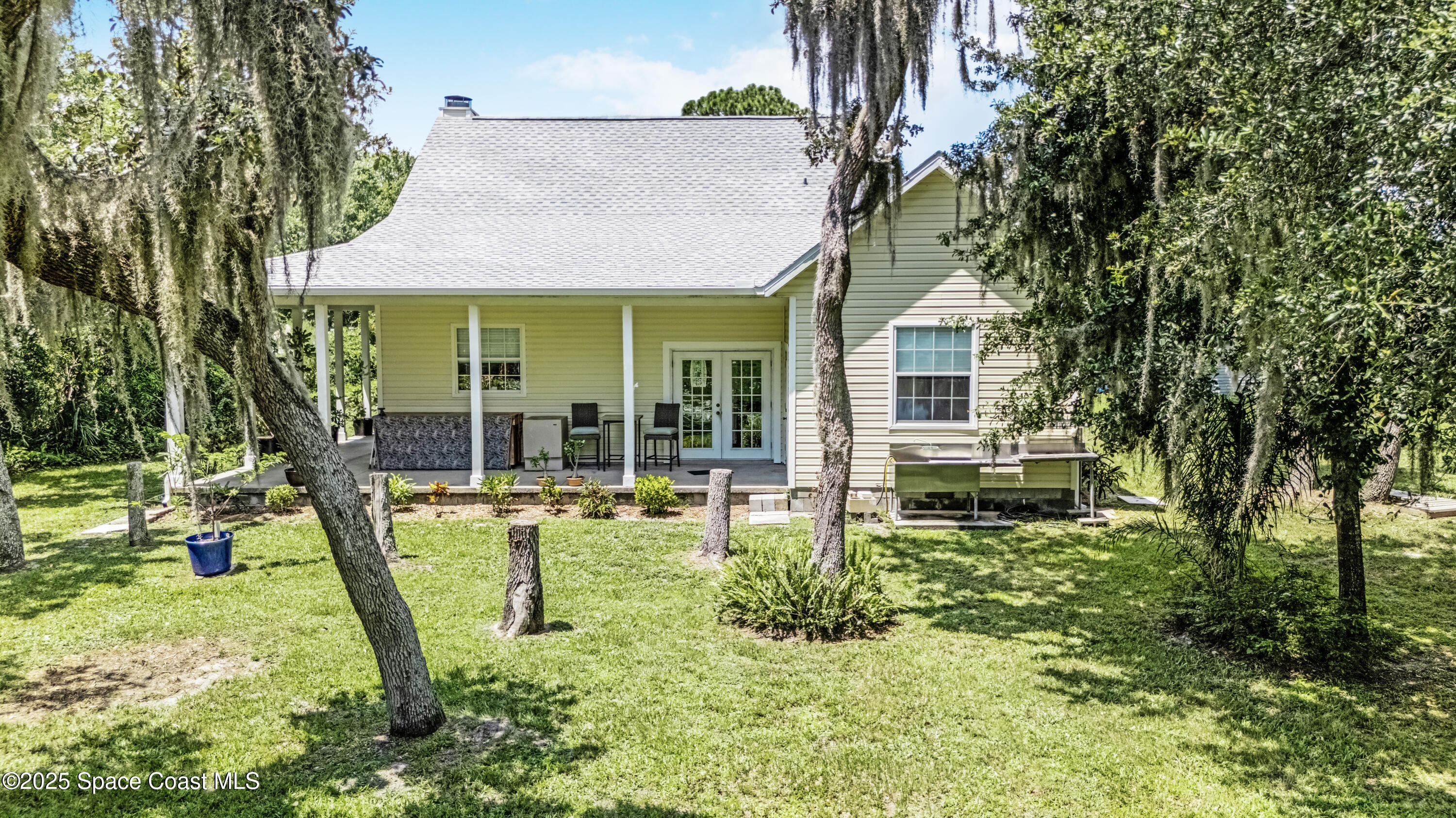 3931 U.S. Rte 1 Mims, FL 32754 - Photo 10 of 47 a view of a house with backyard porch and sitting area