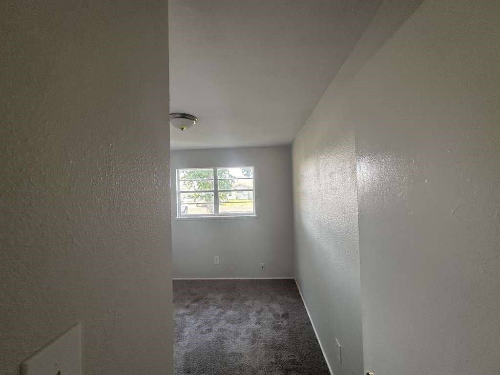 2424 East 28th Street Lubbock, TX 79404 - Photo 11 of 14 an empty room with windows
