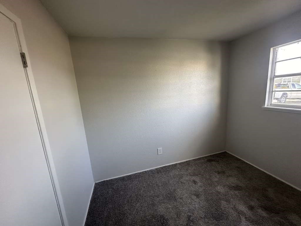 2424 East 28th Street Lubbock, TX 79404 - Photo 12 of 14 an empty room with windows