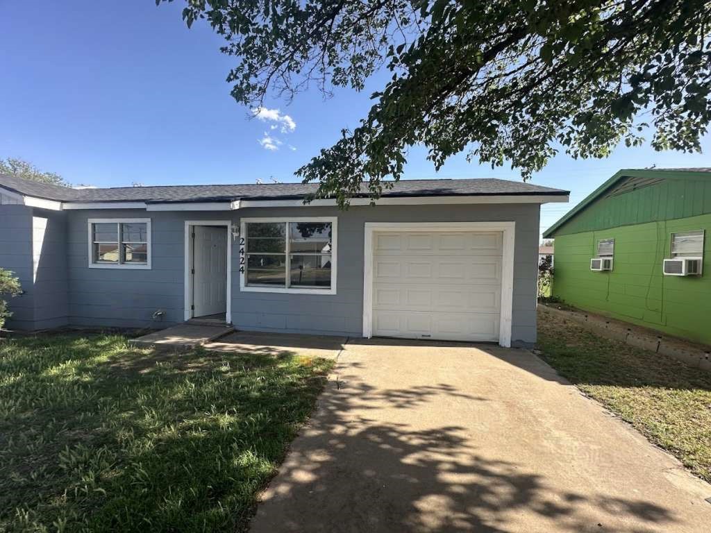 2424 East 28th Street Lubbock, TX 79404 - Photo 2 of 14 a view of a house with a yard