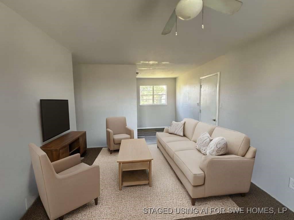 2424 East 28th Street Lubbock, TX 79404 - Photo 6 of 14 a living room with furniture and a flat screen tv