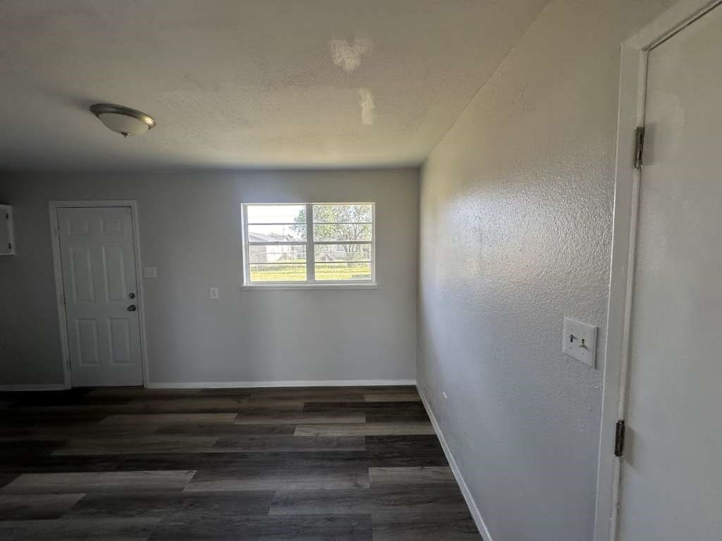 2424 East 28th Street Lubbock, TX 79404 - Photo 7 of 14 a view of an empty room and wooden floor