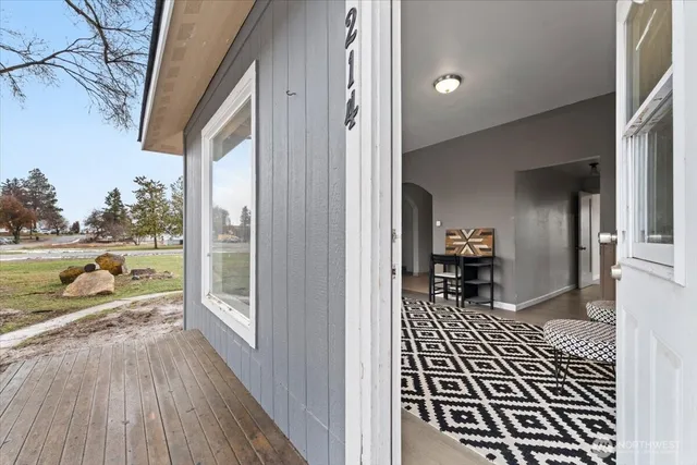 a view of a balcony with wooden floor