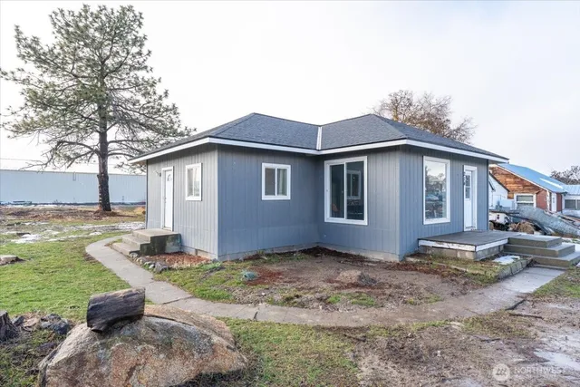 a front view of a house with garden