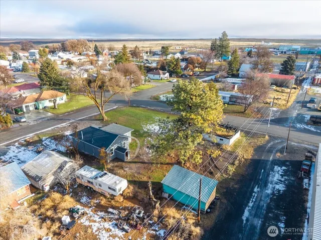 an aerial view of residential houses with outdoor space