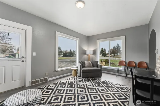 a living room with furniture and a window