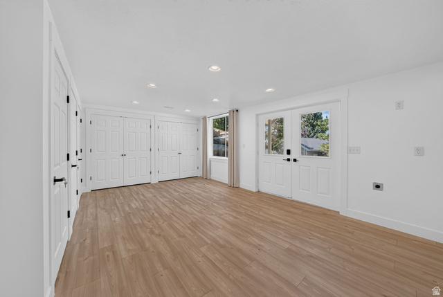 1979 Cave Hollow Way Bountiful, UT 84010 - Photo 38 of 59 Spacious room featuring light wood-finish flooring, recessed lighting, and white walls