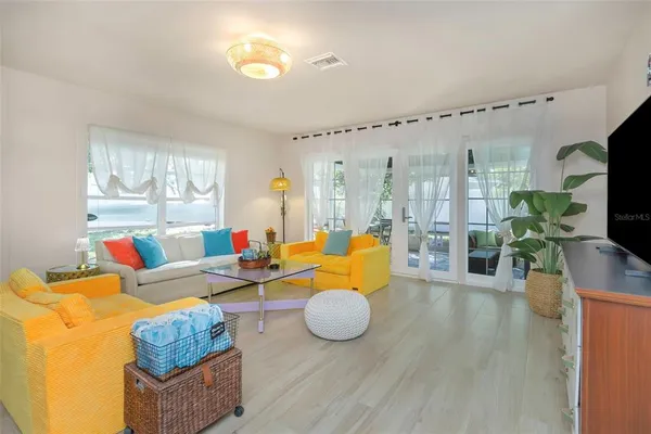 a view of a chairs and a table in a living room