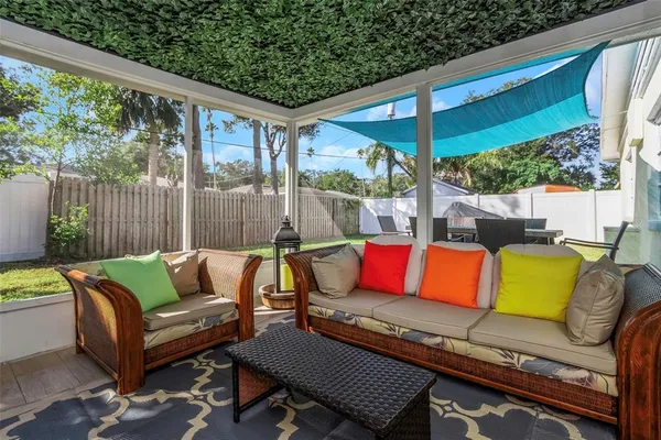 a dining room with furniture and wooden floor