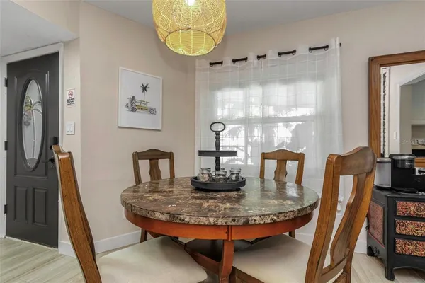 a kitchen with granite countertop a sink a stove and cabinets