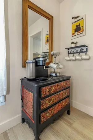 a kitchen with a sink stove top oven and cabinets