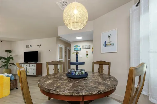 a kitchen with granite countertop a sink a stove and cabinets