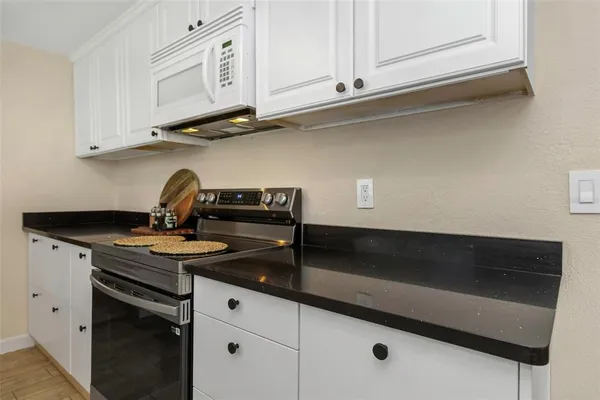 a bedroom with a bed and a chair