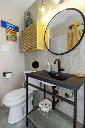 a bedroom with furniture and a window