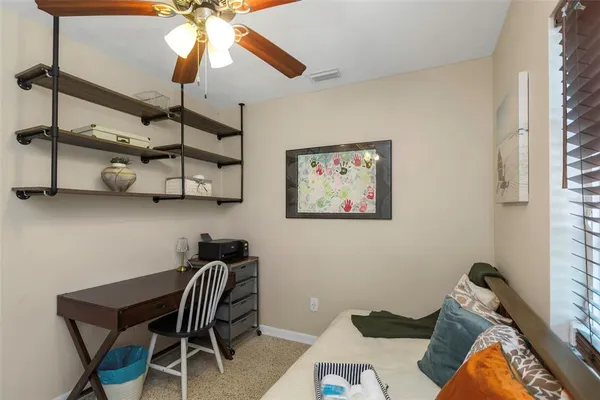 a view of a house with backyard porch and sitting area