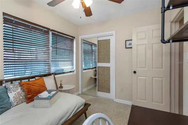 a view of a house with a yard and sitting area