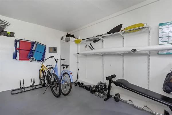 an aerial view of residential houses with outdoor space and lake view