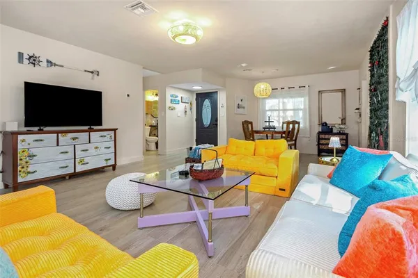 a living room with furniture and a large window