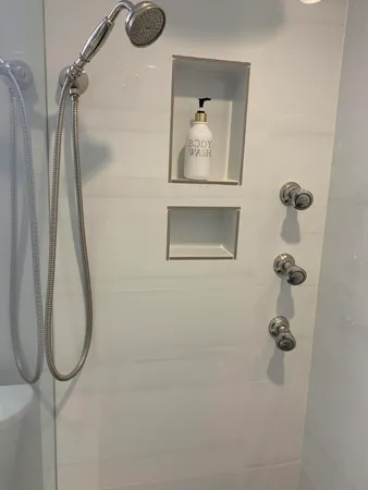 a bathroom with a toilet a sink a vanity and mirror