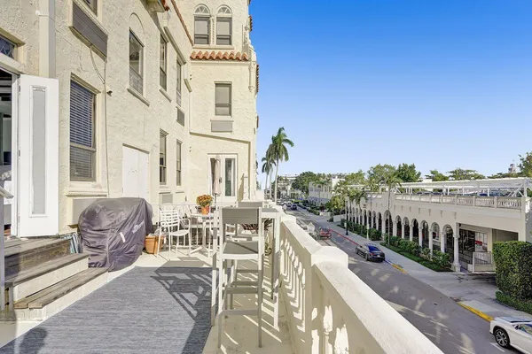a view of a chairs and table in patio