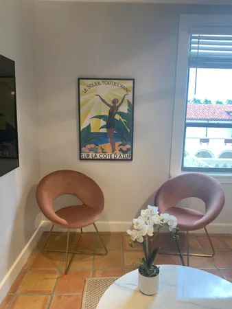 a dining room with furniture and wooden floor