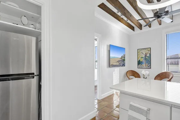 a view of a kitchen with stainless steel appliances granite countertop a sink and cabinets