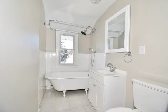a bathroom with a sink toilet and tub