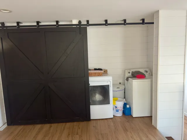 a view of storage and utility room with washer and dryer