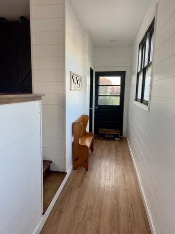 a large kitchen with a stove and a refrigerator