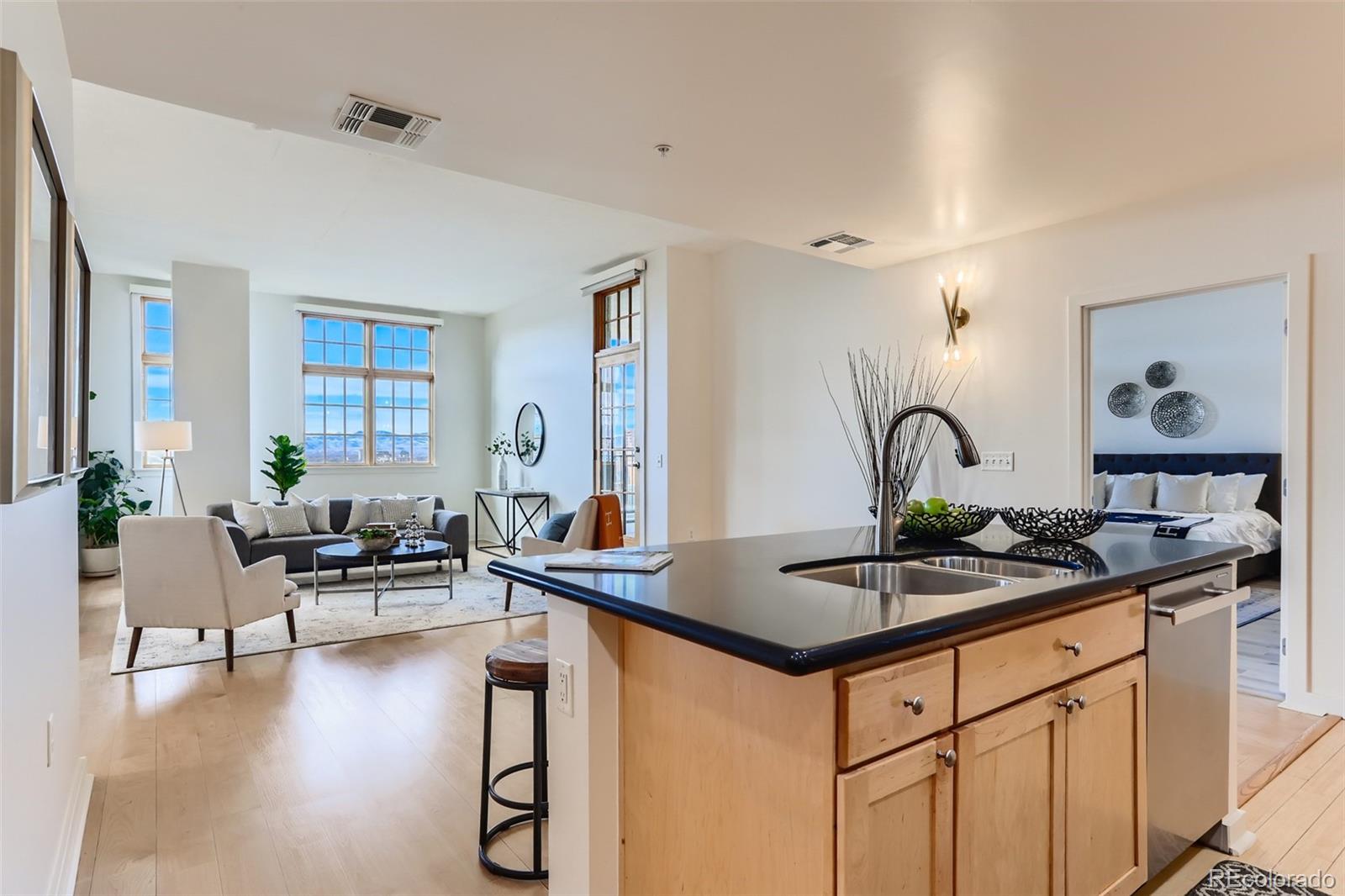 275 South Harrison Street, Unit 602 Denver, CO 80209 - Photo 13 of 33 a kitchen with a table and chairs