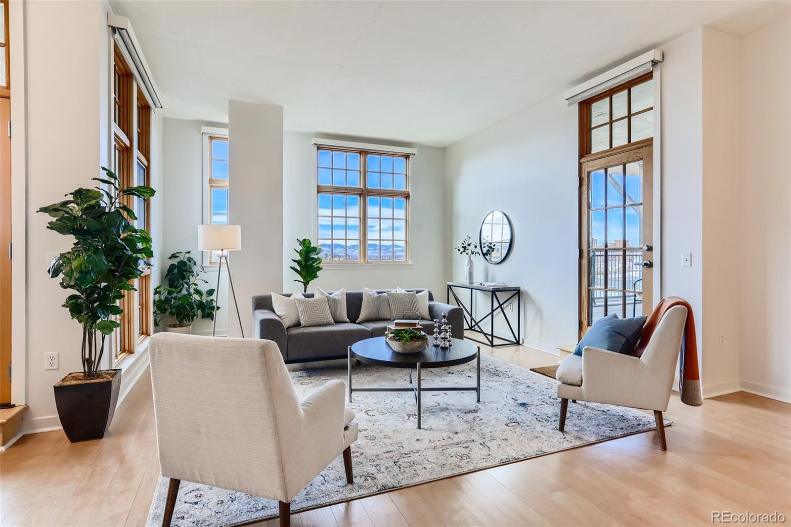 275 South Harrison Street, Unit 602 Denver, CO 80209 - Photo 3 of 33 a living room with furniture potted plant and a window