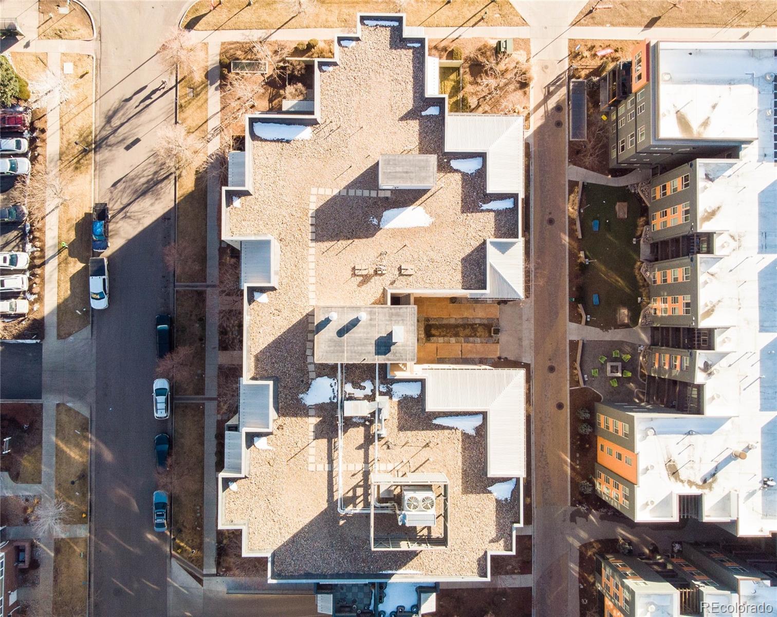275 South Harrison Street, Unit 602 Denver, CO 80209 - Photo 32 of 33 a city street filled with lots of tall buildings