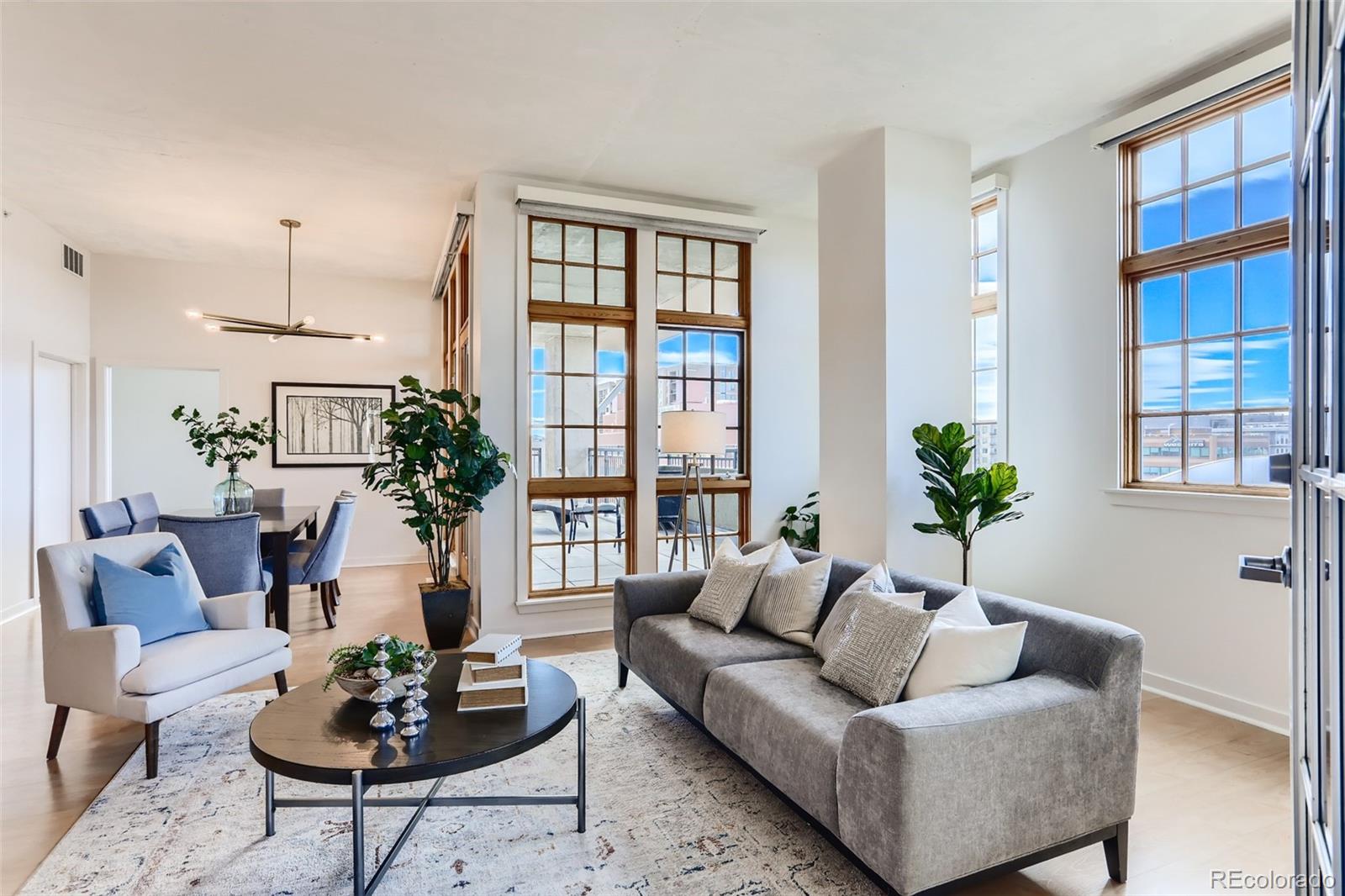 275 South Harrison Street, Unit 602 Denver, CO 80209 - Photo 5 of 33 a living room with furniture potted plant and a large window