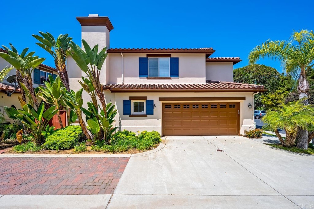 533 Anchorage Avenue Carlsbad, CA 92011 - Photo 3 of 58 a front view of a house with a garden