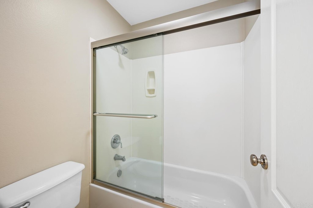533 Anchorage Avenue Carlsbad, CA 92011 - Photo 31 of 58 a bathroom with a shower and a toilet