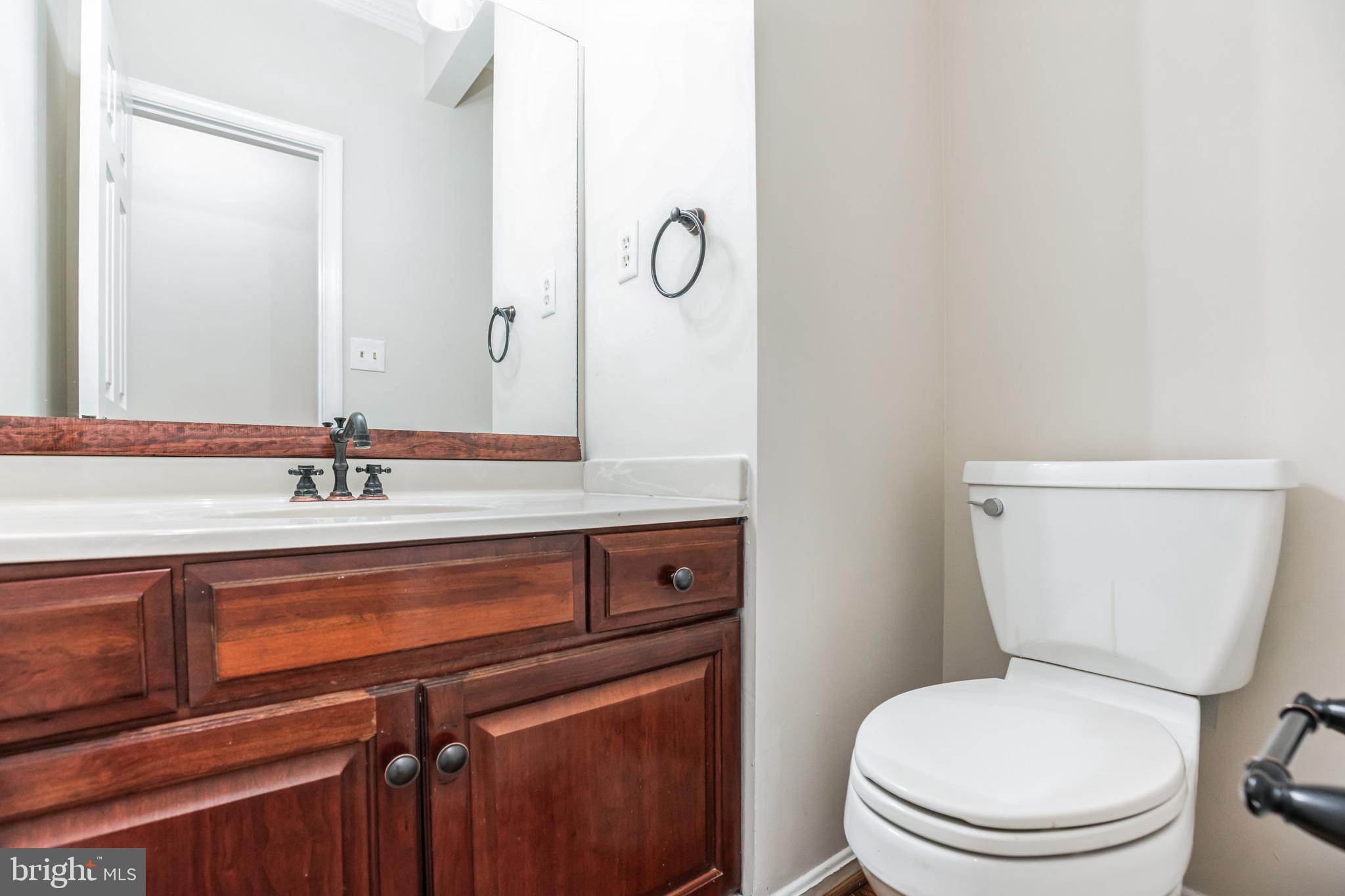 539 Small Reward Road Huntingtown, MD 20639 - Photo 15 of 34 a bathroom with a toilet sink and mirror