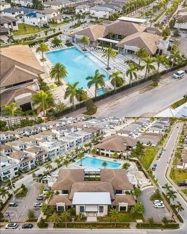 an aerial view of residential houses with outdoor space