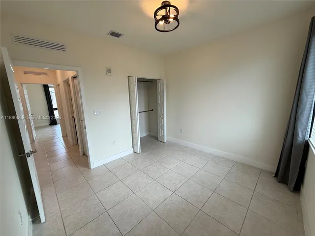 an empty room with a mirror