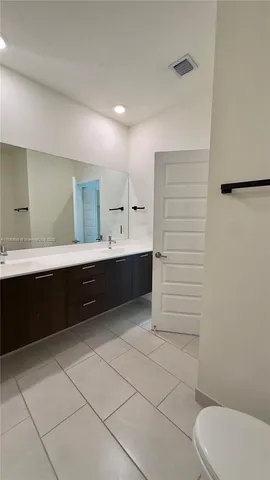 a view of kitchen with microwave and furniture