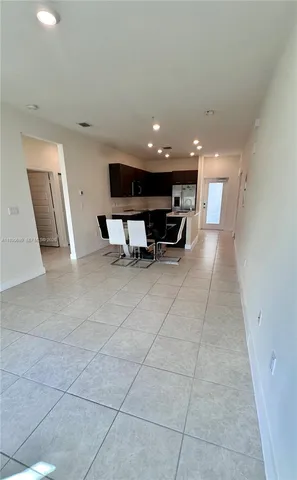 a view of kitchen with microwave and furniture