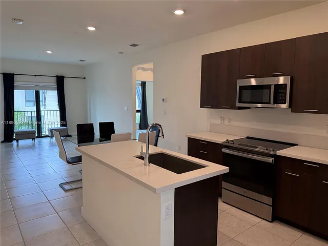 a kitchen with a sink and a microwave