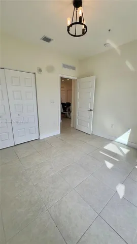 a bathroom with a sink a toilet a mirror and shower