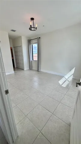 a bathroom with a shower and a glass door