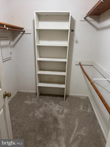 a bathroom with a sink vanity and mirror