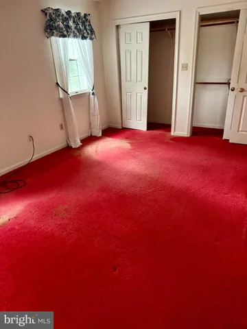 a room with a bed and a yard