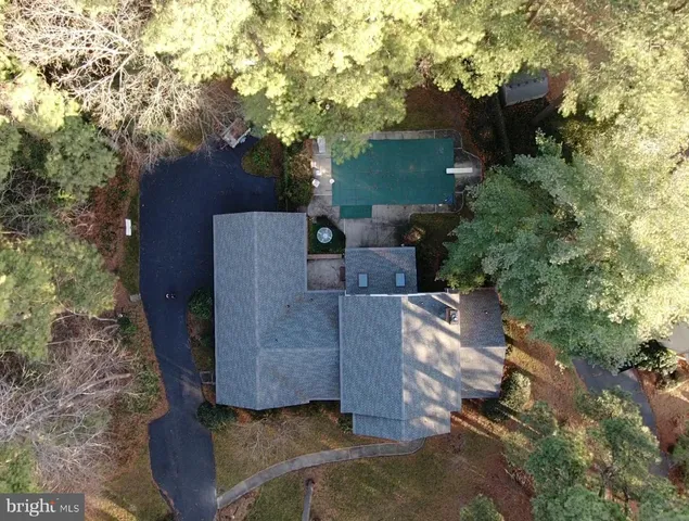 a view of a couches in the patio next to a yard