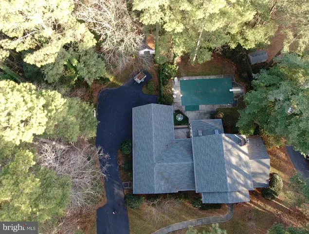 a view of balcony with table and chairs and a fire pit