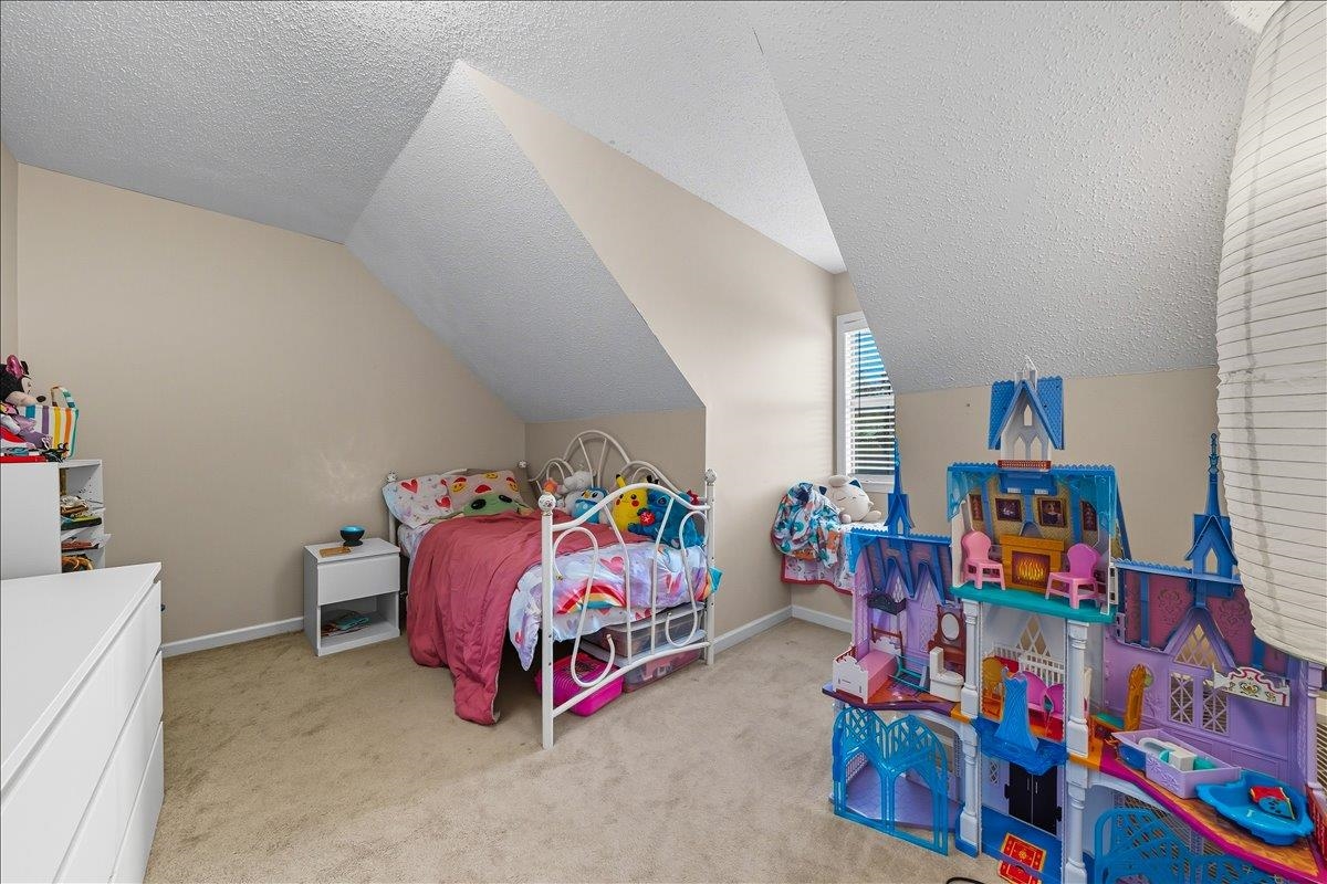 6870 Deerfield Road Bartlett, TN 38135 - Photo 20 of 28 Bedroom with light colored carpet and baseboards