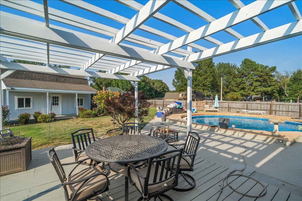 6870 Deerfield Road Bartlett, TN 38135 - Photo 22 of 28 Wooden deck with outdoor dining area, a patio area, and a fenced backyard