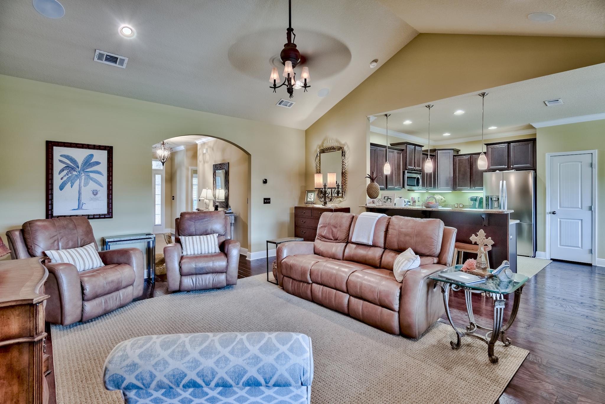 386 Pin Oak Loop Santa Rosa Beach, FL 32459 - Photo 13 of 47 a living room with furniture and a chandelier